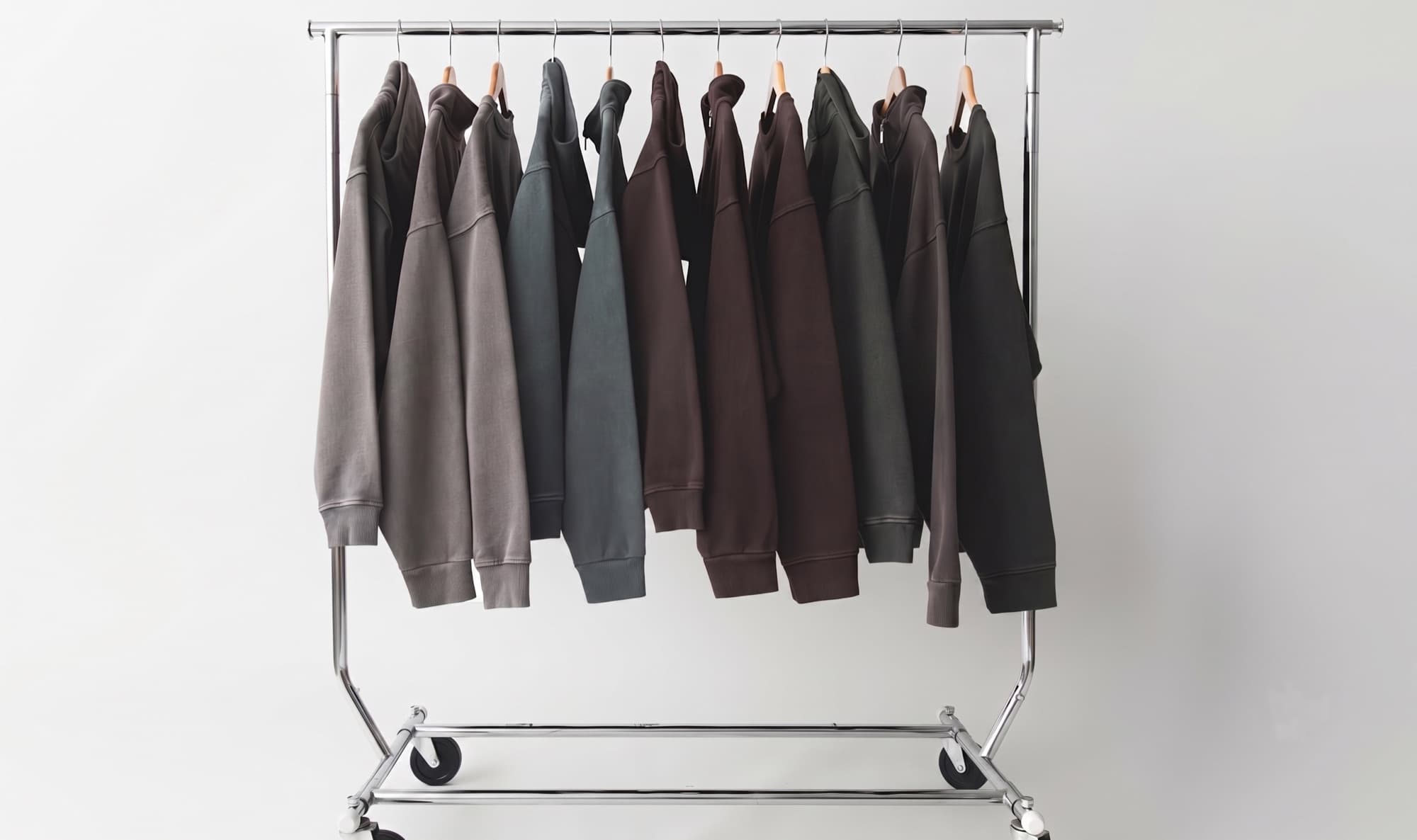 A rack of blank hoodies and sweatshirts ready for custom printing